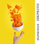 Small photo of Levitation or flying of spicy hot Nachos mexican crispy crunchy tortilla chips with slices of chili pepper served as appetizer in white bowl with woman hand or palm isolated against yellow background