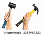 Different hammers in a woman's hand on a white background. A tool with signs of wear in a woman's hand.
