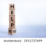 Help you or me symbol. Turned wooden cubes and changed words help me to help you. Beautiful white background, copy space. Business, motivational and help you or me concept.