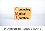 Small photo of CME, continuing medical education symbol. Wooden blocks with words CME, continuing medical education on beautiful white background. Business, CME, continuing medical education concept.