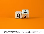 Small photo of From 3rd to 4th quarter symbol. Turned a wooden cube and changed words 'Q3' to 'Q4'. Beautiful orange table, orange background. Business, happy 4th quarter Q4 concept, copy space.