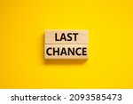 Time to last chance symbol. Concept words Last chance on wooden blocks on a beautiful yellow background. Business and time to last chance concept. Copy space.