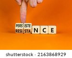 Small photo of Persistence or resistance symbol. Businessman turns cubes, changes the word 'resistance' to 'persistence'. Beautiful orange background. Copy space. Business and persistence or resistance concept.