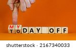 Small photo of Today is my day off symbol. Businessman turns cubes and changes concept words Today off to My day off. Beautiful orange background, copy space. Business motivation today is my day off concept.
