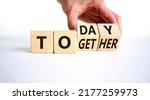 Small photo of Today we are together symbol. Businessman turns wooden cubes and changes the word together to today. Beautiful white background, copy space. Business and today we are together concept.