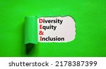 Small photo of DEI Diversity equity and inclusion symbol. Concept words DEI diversity equity and inclusion on the white paper on beautiful green background. Business DEI diversity equity and inclusion concept.