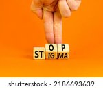 Small photo of Stop stigma symbol. Concept words Stop stigma on wooden cubes. Businessman hand. Beautiful orange table orange background. Business and Stop stigma concept. Copy space.