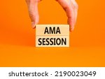 Small photo of AMA ask me anything session symbol. Concept words AMA ask me anything session on wooden blocks on a beautiful orange background. Business and AMA ask me anything session concept. Copy space.