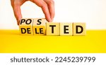 Small photo of Posted or deleted symbol. Businessman turns wooden cubes and changes the word 'deleted' to 'posted'. Beautiful white background. Business and posted or deleted concept. Copy space.