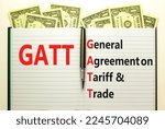 Small photo of GATT symbol. Concept words GATT general agreement on tariff and trade on white note on beautiful white background. Business GATT general agreement on tariff and trade concept. Copy space.