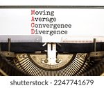 Small photo of MACD symbol. Concept words MACD moving average convergence divergence typed on retro typewriter on beautiful white background. Business MACD moving average convergence divergence concept. Copy space.