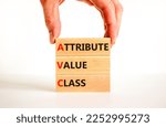Small photo of AVC attribute value class symbol. Concept words AVC attribute value class on wooden blocks. Beautiful white background, businessman hand, copy space. Business and AVC attribute value class concept.