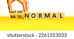 Small photo of Good or bad normal symbol. Hand turns cubes and changes words 'bad normal' to 'good normal'. Business and Covid-19 good or bad normal concept. Beautiful white background, copy space.
