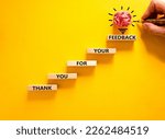 Small photo of Thank you for feedback symbol. Concept words Thank you for your feedback on wooden blocks on a beautiful yellow table yellow background. Businessman hand. Business and thank you for feedback concept.