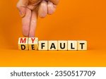 Small photo of Default is my fault symbol. Concept words Default and My fault on wooden cubes. Beautiful orange table orange background. Businessman hand. Business default is my fault concept. Copy space.