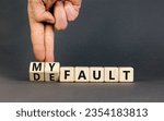 Small photo of Default is my fault symbol. Concept words Default and My fault on wooden cubes. Beautiful grey table grey background. Businessman hand. Business default is my fault concept. Copy space.