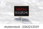 Small photo of Positive discipline symbol. Concept words Positive discipline on beautiful black chalk blackboard. Chalkboard. Beautiful snow background. Business psychology positive discipline concept. Copy space.