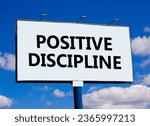 Small photo of Positive discipline symbol. Concept words Positive discipline on beautiful big white billboard. Beautiful blue sky cloud background. Business psychology positive discipline concept. Copy space.
