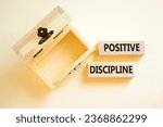 Small photo of Positive discipline symbol. Concept words Positive discipline on beautiful wooden blocks. Beautiful white background. Empty wooden chest. Business psychology positive discipline concept. Copy space.