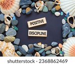 Small photo of Positive discipline symbol. Concept words Positive discipline on beautiful wooden blocks. Seashell. Beautiful black table black background. Business psychology positive discipline concept. Copy space.