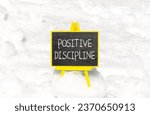Small photo of Positive discipline symbol. Concept words Positive discipline on beautiful black chalk blackboard. Chalkboard. Beautiful snow background. Business psychology positive discipline concept. Copy space.