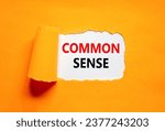 Common sense symbol. Concept words Common sense on beautiful white paper. Beautiful orange table orange background. Business, motivational common sense concept. Copy space.