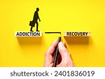 Small photo of Addiction recovery symbol. Concept words Addiction recovery on beautiful wooden blocks. Psychologist icon. Beautiful yellow table yellow background. Psychology addiction recovery concept. Copy space.