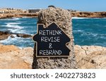 Small photo of Rethink revise rebrand symbol. Concept word Rethink Revise and Rebrand on beautiful blackboard. Beautiful red stone background. Business brand motivational rethink revise rebrand concept. Copy space.