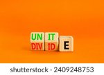 Small photo of Unite or divide symbol. Concept word Unite or Divide on wooden cubes. Beautiful orange table orange background. Business unite or divide concept. Copy space.