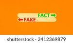 Small photo of Fact or fake symbol. Concept word Fake and Fact on beautiful wooden stick. Beautiful orange table orange background. Business and fact or fake concept. Copy space.