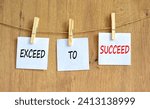 Small photo of Exceed to succeed symbol. Concept words Exceed to succeed on beautiful white paper on clothespin. Beautiful wooden table wooden background. Business and exceed to succeed concept. Copy space.