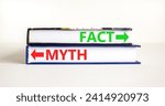 Small photo of Fact or myth symbol. Concept word Myth and Fact on beautiful books. Beautiful white table white background. Business and fact or myth concept. Copy space.