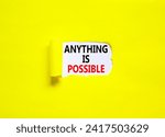 Small photo of Anything is possible symbol. Concept words Anything is possible on beautiful white paper. Beautiful yellow paper background. Business anything possible concept. Copy space.