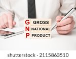 Small photo of GNP Gross National Product text wooden cube blocks on table background. Idea, Strategy, advertising, marketing, Keyword and Content concept