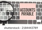 Small photo of Notepad with the text on laptop ACCOUNTS PAYABLE