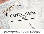 Small photo of CAPITAL GAINS TAX, business concept image with soft focus background and vintage tone