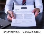 Small photo of business man submitting resume to submit job application, head of personnel checking resume on job applicant's resume, resume job application form ideas