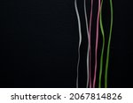 Small photo of lines, wire, colored wires, black background, pink wire, gray wire, green wire, gadgets.