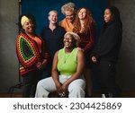 Small photo of Portrait of six LGBTQIA queer people laughing together for pride month