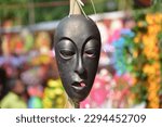 Small photo of A gruesome mask is displayed for sale in the market