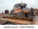 Small photo of Chittagong,Bangladesh 30th May 2016: Inside of Ship breaking yard chittagong,Bangldesh. Without safety equipment, workers are at risk.