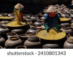Small photo of Homemade soy sauce facility in Vietnam. People are making Ban soya sauce at Ban Ward, Hung Yen province, Vietnam. Travel concept