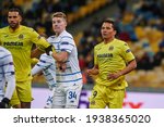 Small photo of KYIV, UKRAINE - MARCH 11, 2021: forward Carlos Bacca, defender Oleksandr Syrota vs midfielder Etienne Capoue during the match of UEFA Europa League Dynamo Kyiv vs Villarreal at NSC Olympic in Kyiv