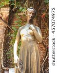 Small photo of Famous bronze statue of Juliet Capulet standing in front of Juliet Balcony, in Verona, Italy. It's believed that if touch on Juliet's right breast, they will be blessed in their love life. Warm toned.