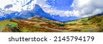 Panorama of a mountain valley under the clouds. Mountain panorama. Mountain valley panoramic landscape. Mountain panoramic landscape