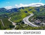 Panoramic 101 Ventura Highway in Southern California winding through green hills and valleys from Thousand Oaks to Northern California 