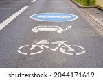 Lane marking for electric cars, buses and bicycles.                               
