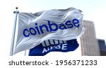 Small photo of New York, USA, April 14 2021. Flags of Coinbase and NYSE flying in the wind. On April 14, 2021, Coinbase went public on the Nasdaq exchange via a direct stock listing