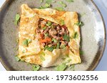 Small photo of Egg stuffed with minced pork and tomato crat, fried to combine, wrapped in egg