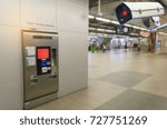 Small photo of CCTV security indoor camera system operating with self service ticket or ticket vending machine at train station, transportation, surveillance security, safety technology concept